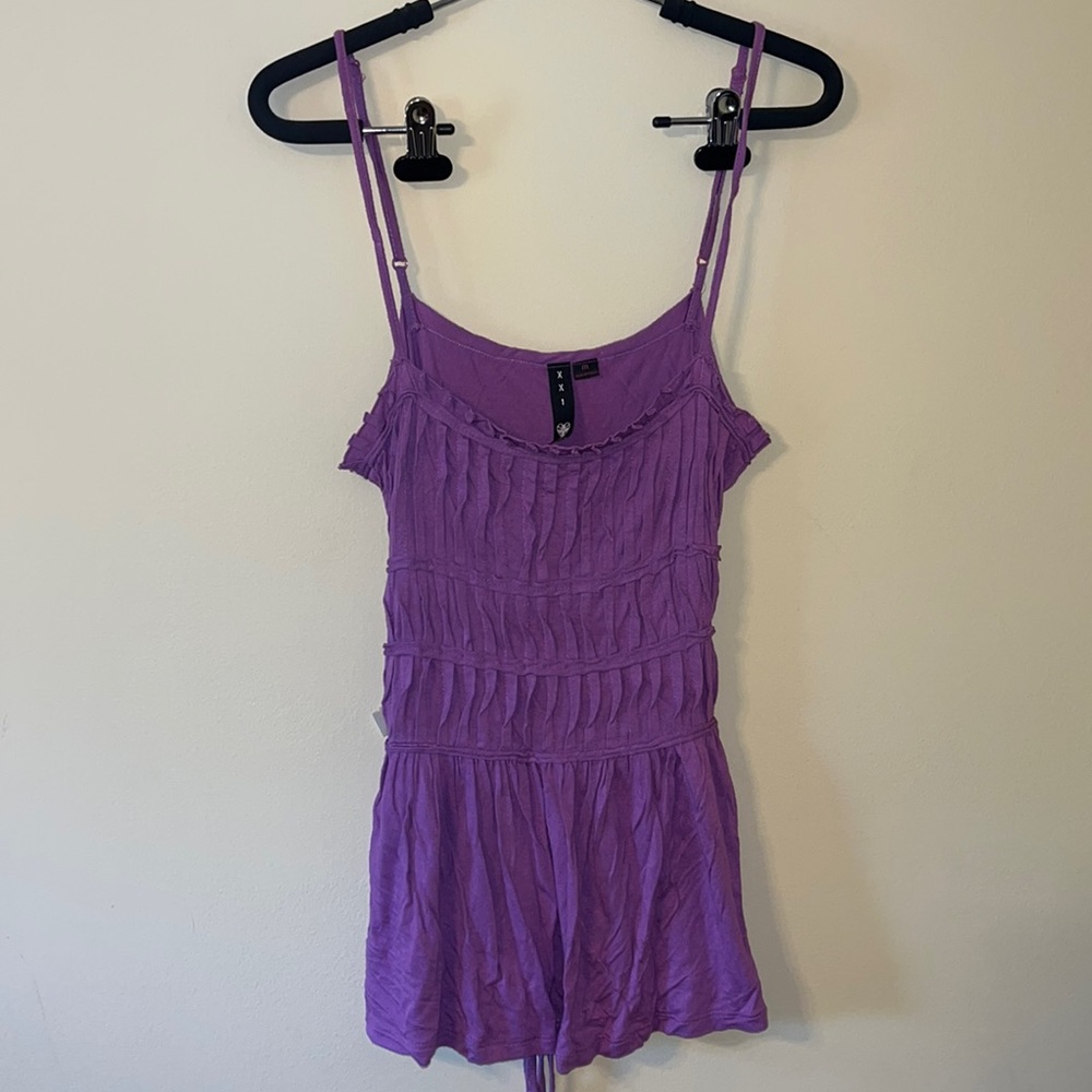 A purple tank top with tie in the back